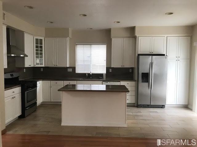 1228 Alder Creek Circle San Leandro, CA 94577 - Photo 5 of 9 a kitchen with a refrigerator and a sink