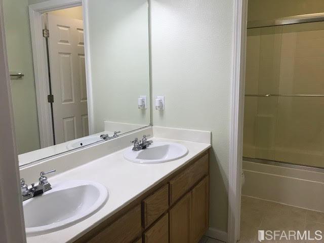 1228 Alder Creek Circle San Leandro, CA 94577 - Photo 8 of 9 a bathroom with a sink and a mirror