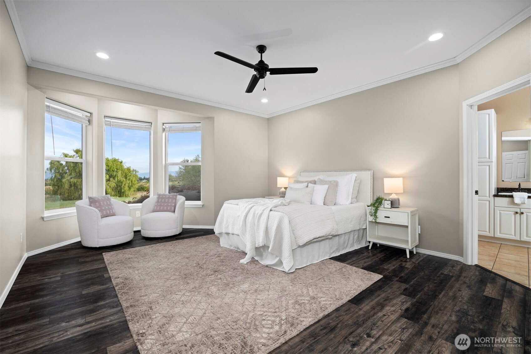 6729 Hawk Ridge Drive Ferndale, WA 98248 - Photo 17 of 40 a spacious bedroom with a bed and wooden floor