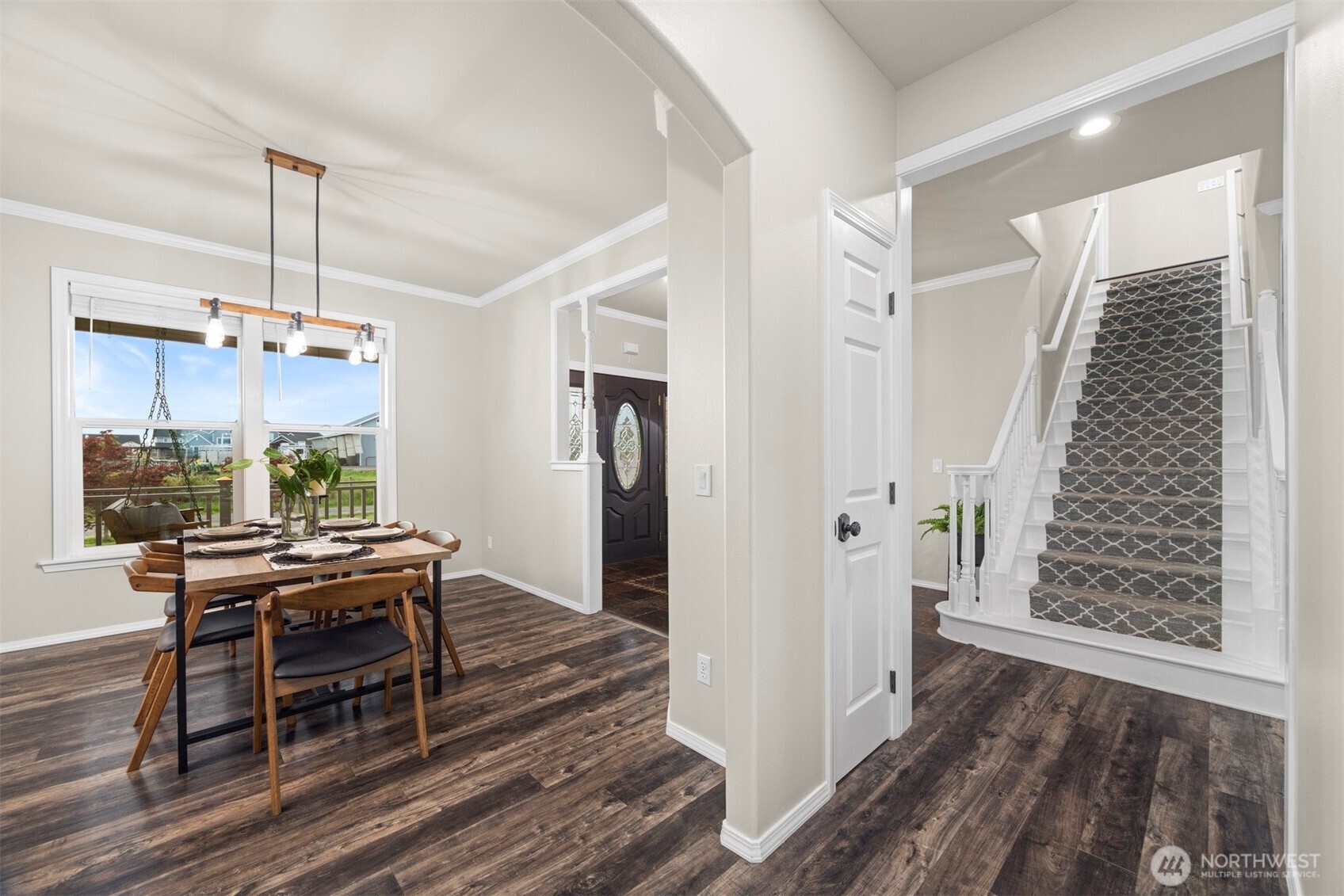 6729 Hawk Ridge Drive Ferndale, WA 98248 - Photo 5 of 40 a view of a dining room with furniture window and wooden floor