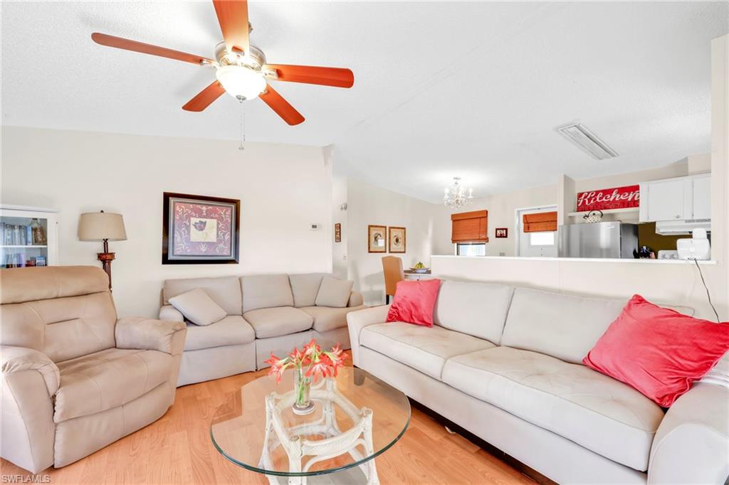 41 Oceans Boulevard, Unit 41 Naples, FL 34104 - Photo 9 of 32 a living room with furniture and a white couch