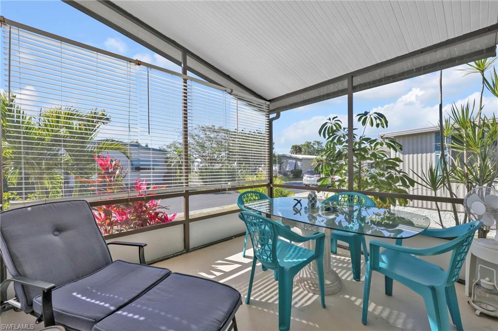 41 Oceans Boulevard, Unit 41 Naples, FL 34104 - Photo 10 of 32 a outdoor living space with furniture and garden view