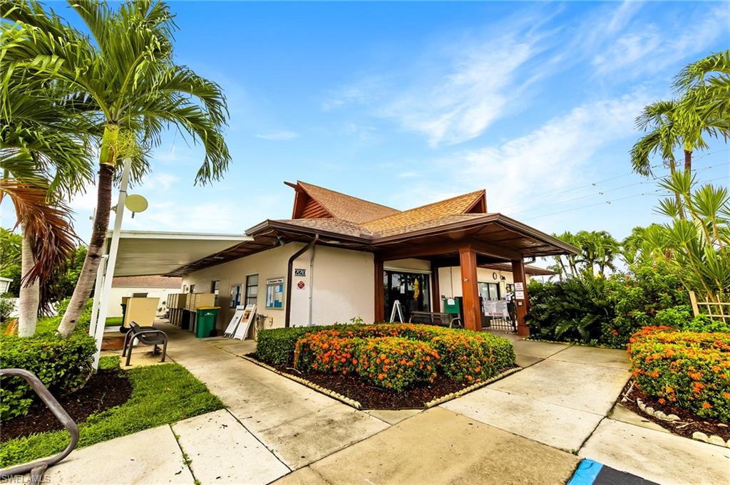 41 Oceans Boulevard, Unit 41 Naples, FL 34104 - Photo 23 of 32 a front view of a house with a yard
