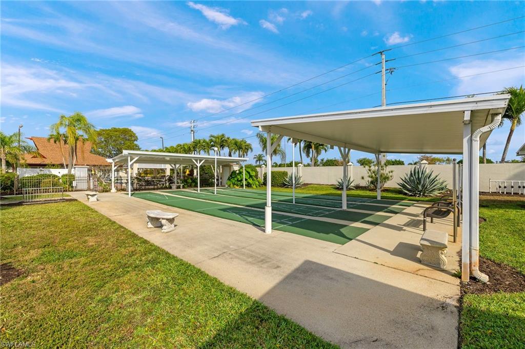 41 Oceans Boulevard, Unit 41 Naples, FL 34104 - Photo 27 of 32 a view of a house with a backyard