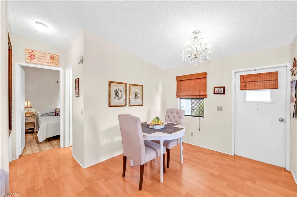 41 Oceans Boulevard, Unit 41 Naples, FL 34104 - Photo 5 of 32 a view of a dining room with furniture