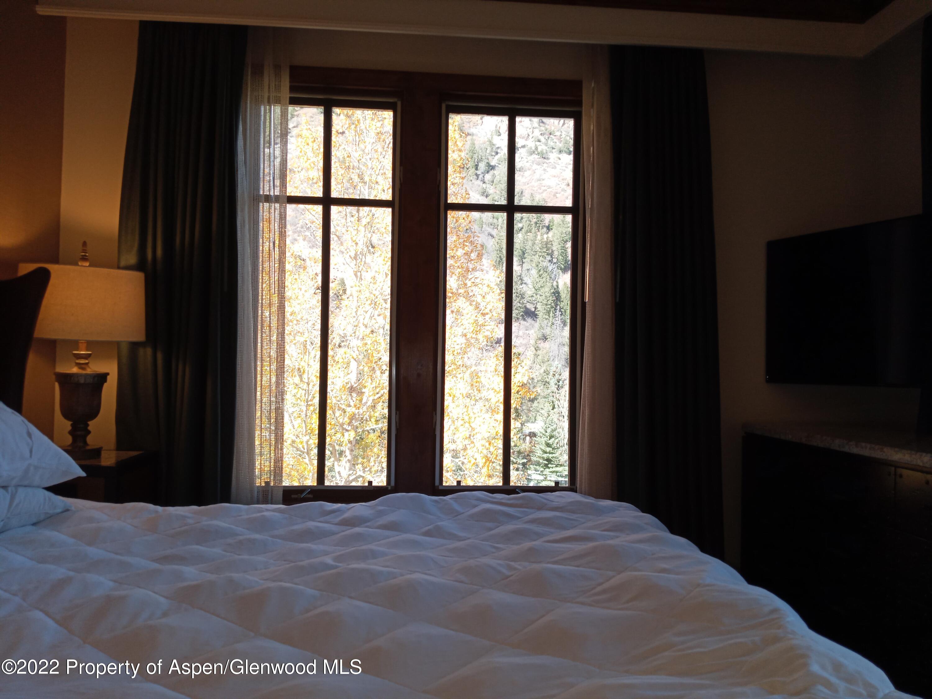 39 Boomerang Road, Unit 8216 SUMMER INTEREST 8 Aspen, CO 81611 - Photo 14 of 27 a view of a room with a large window