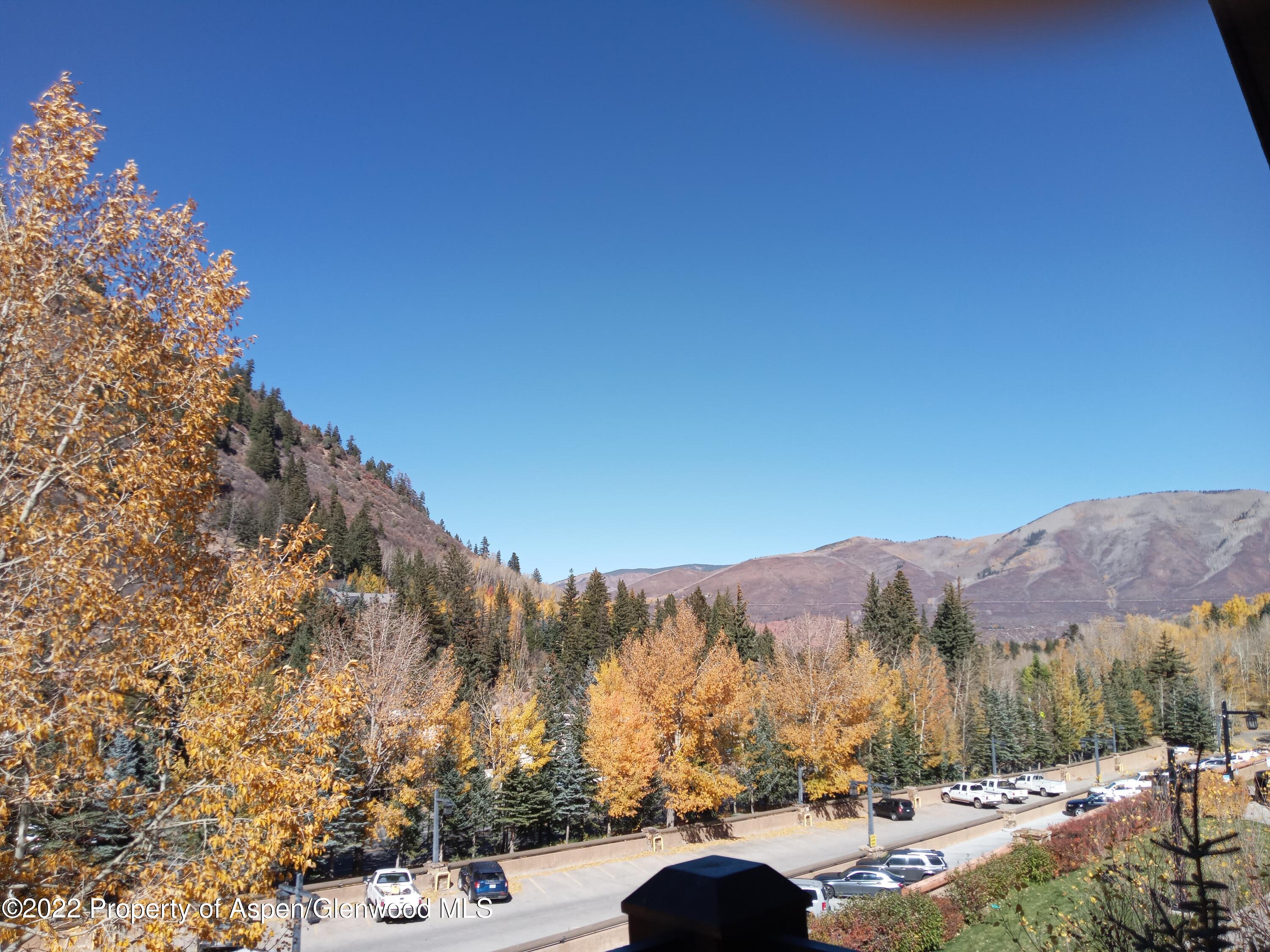39 Boomerang Road, Unit 8216 SUMMER INTEREST 8 Aspen, CO 81611 - Photo 24 of 27 a view of a street with mountains in the background