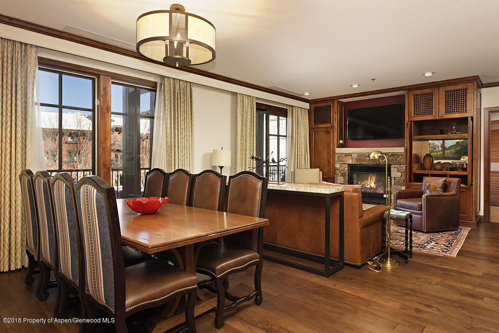39 Boomerang Road, Unit 8216 SUMMER INTEREST 8 Aspen, CO 81611 - Photo 4 of 27 a view of a dining room with furniture window and wooden floor
