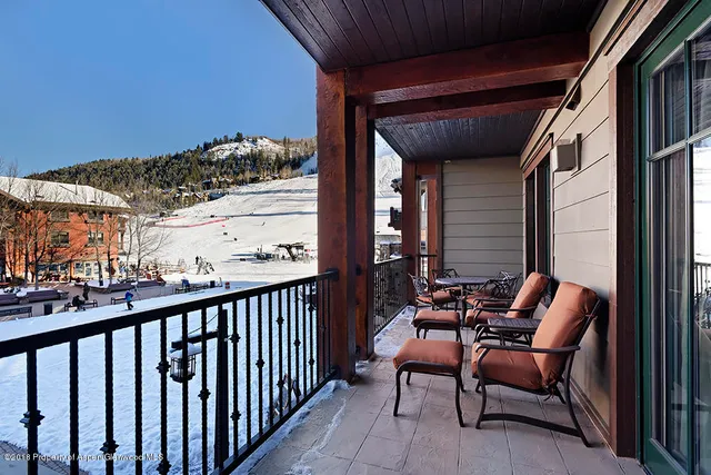 a view of balcony with furniture