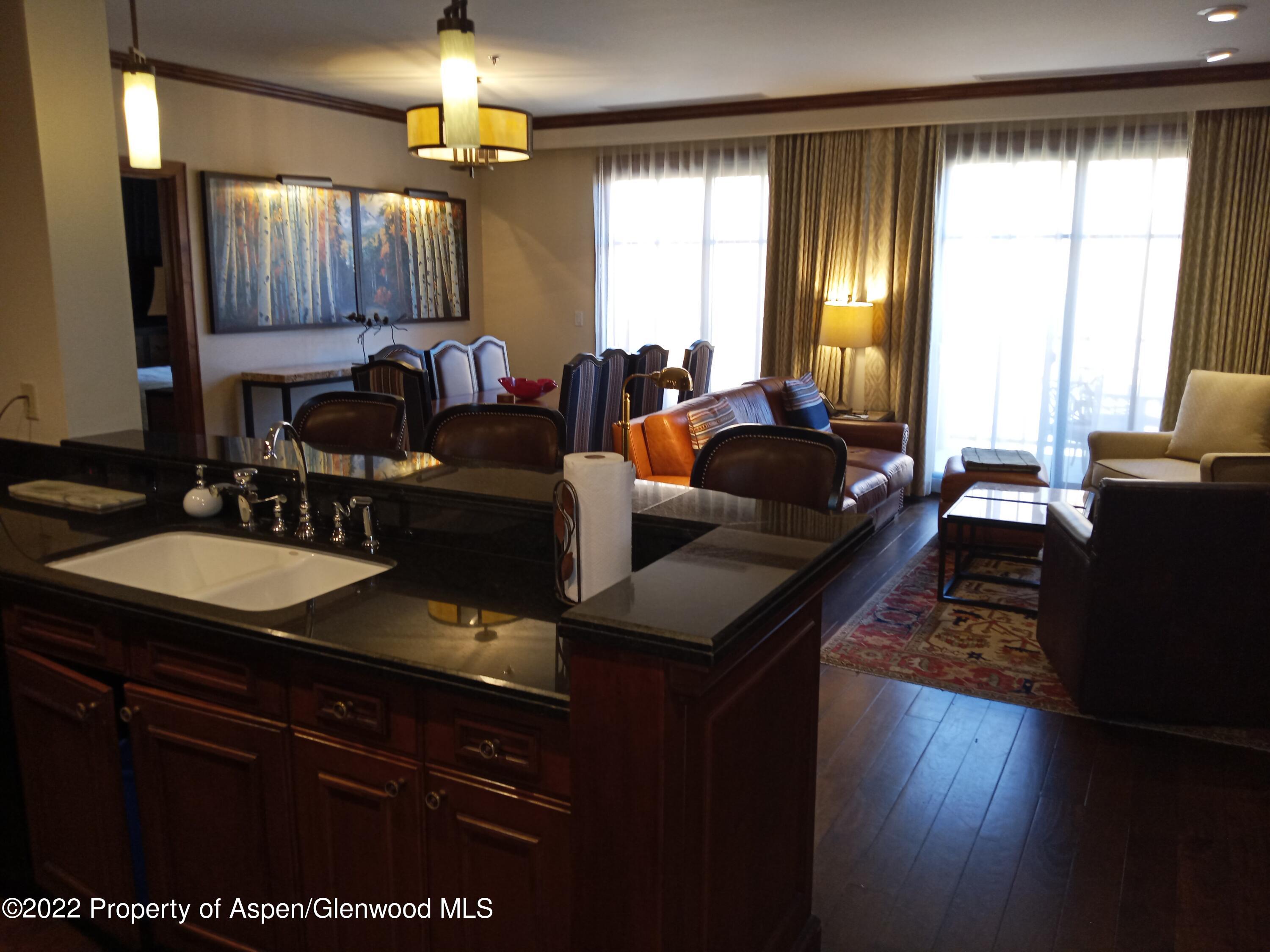 39 Boomerang Road, Unit 8216 SUMMER INTEREST 8 Aspen, CO 81611 - Photo 8 of 27 a living room with furniture and a large window