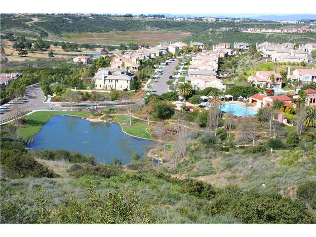 2390 Lapis Road Carlsbad, CA 92009 - Photo 21 of 25 Here's a good arial showing the La Costa Greens duck pond, Presidio Clubhouse & Pool. The Large meadow at the top left of picture is where the City of Carlsbad is putting in "Alga Norte Aquatic Park" ... it will feature 2 pools, skate park & more ...