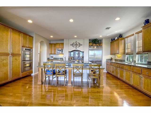 2390 Lapis Road Carlsbad, CA 92009 - Photo 4 of 25 Lots of storage and cabinent space. Unigue dine-in granite island is perfect for casual meals and entertaining.