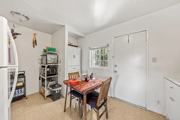 a room with a table and a window