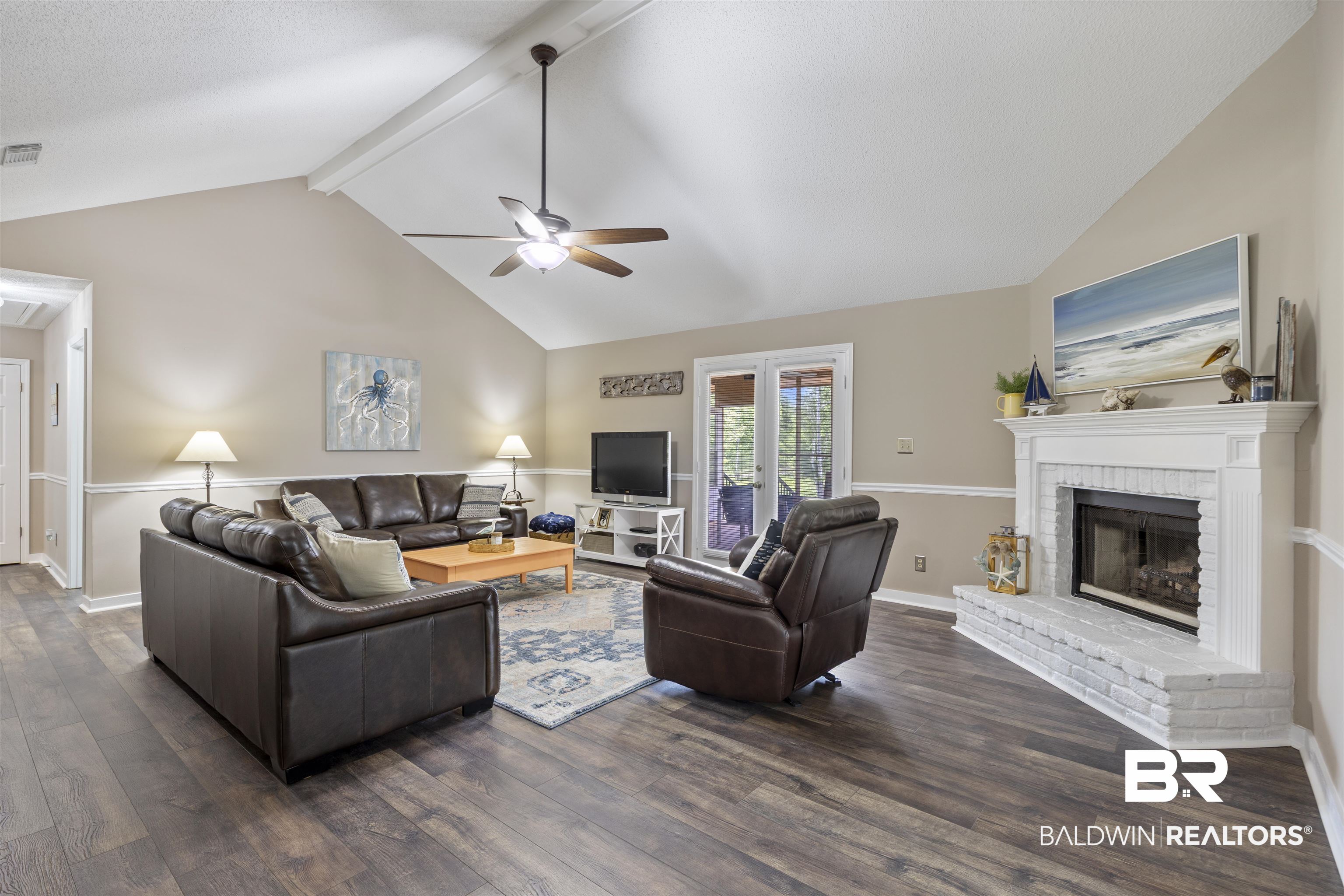 9771 Clarke Ridge Road Foley, AL 36535 - Photo 25 of 72 Living area featuring visible vents, a fireplace, ceiling fan, dark wood-style floors, and vaulted ceiling with beams