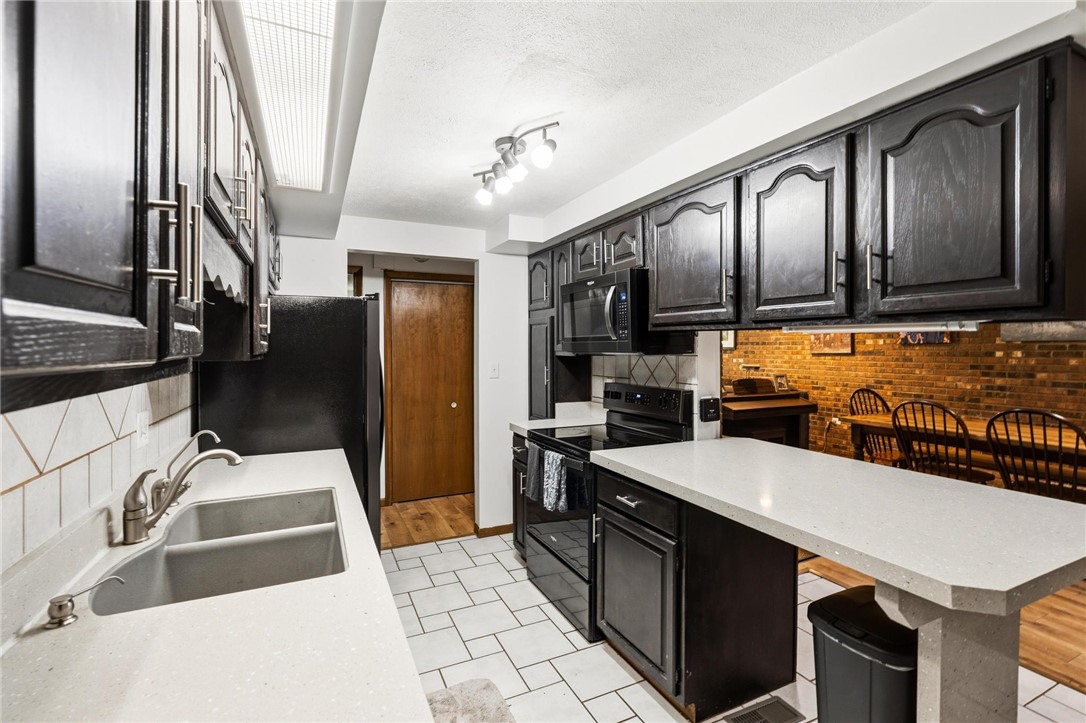 1940 Armstrong Road Fairborn, OH 45324 - Photo 25 of 48 This functional kitchen features ample counter space and appliances, perfect for daily living and entertaining.