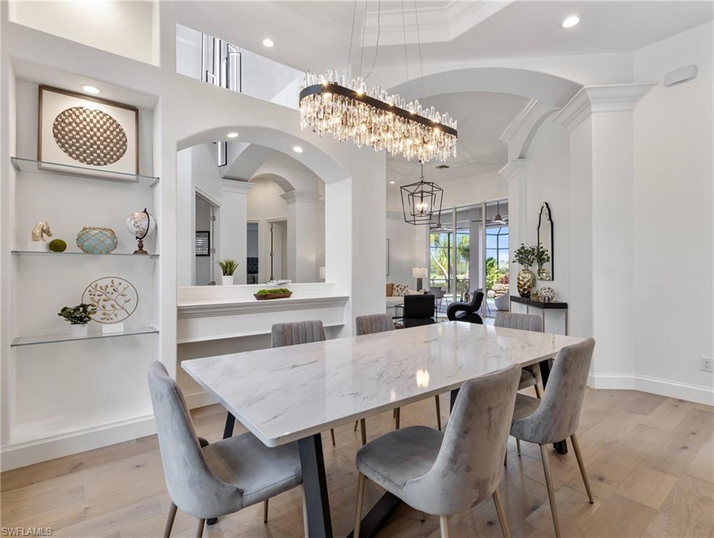 20451 Wildcat Run Drive Estero, FL 33928 - Photo 8 of 49 a view of a dining room with furniture