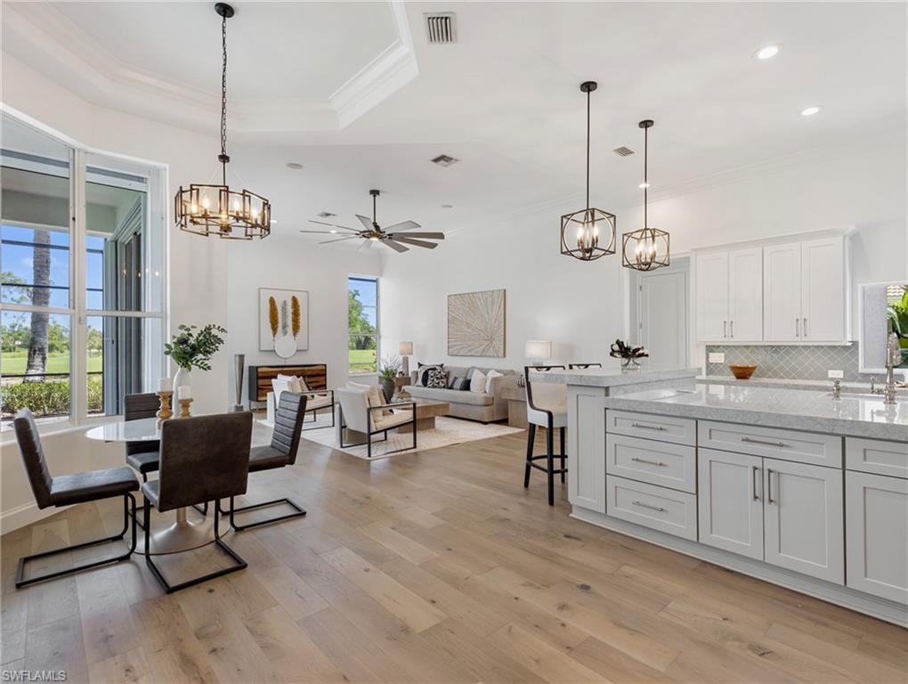 20451 Wildcat Run Drive Estero, FL 33928 - Photo 9 of 49 a view of a room and kitchen with windows