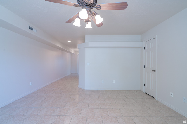 1735 West 540 North, Unit 1805 St. George, UT 84770 - Photo 9 of 64 Spacious room featuring neutral-toned tile flooring, a decorative ceiling fan with light fixture, and recessed lighting