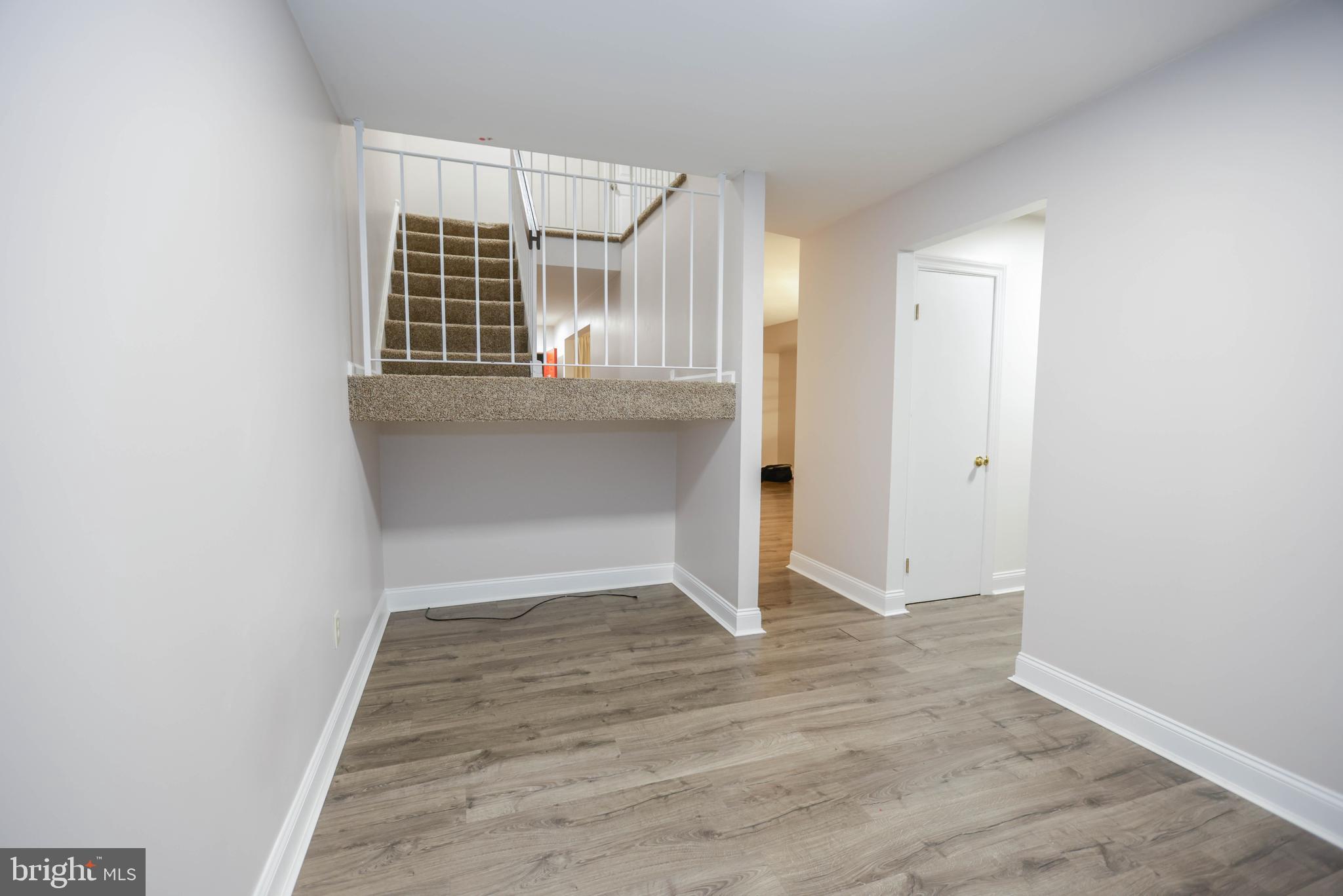 742 Summit Chase Drive Reading, PA 19611 - Photo 17 of 20 an empty room with wooden floor and windows