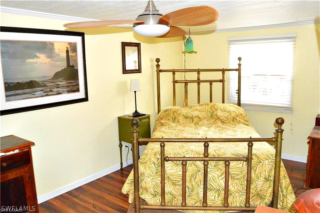 2591 Cay Cove Matlacha, FL 33993 - Photo 15 of 20 a view of a dining room with furniture and a window