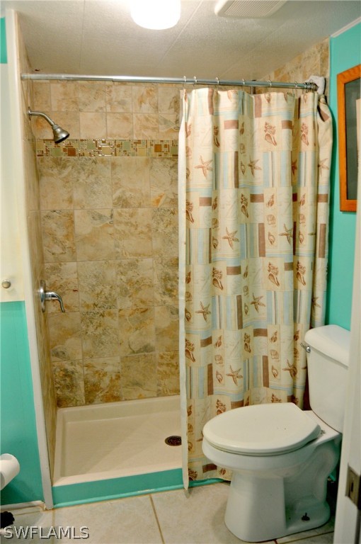 2591 Cay Cove Matlacha, FL 33993 - Photo 18 of 20 a bathroom with a toilet and shower