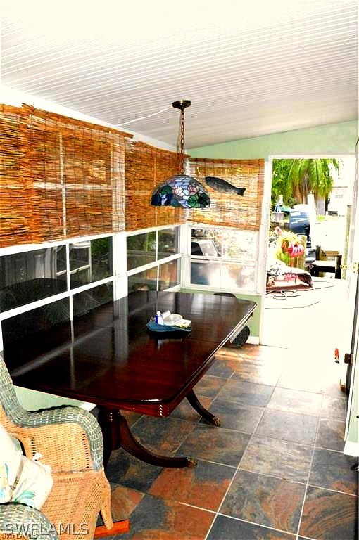 2591 Cay Cove Matlacha, FL 33993 - Photo 20 of 20 a living room with a table and chairs