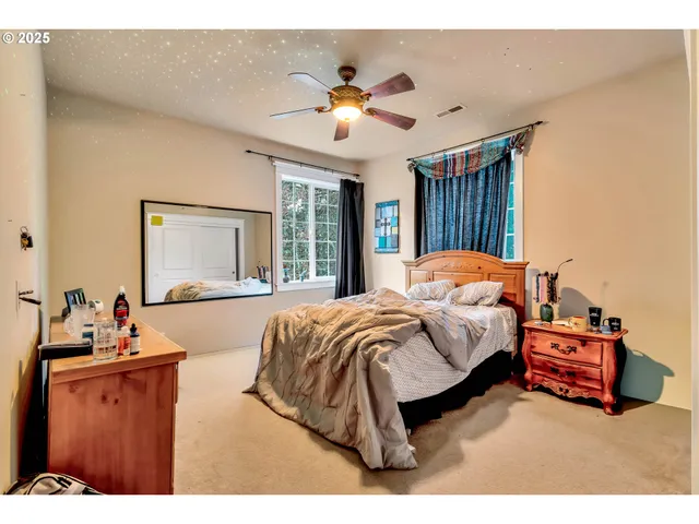 a bedroom with bed and window