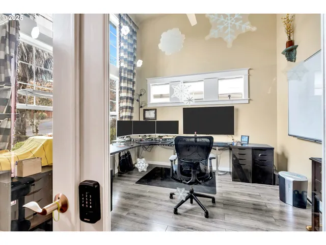 a view of a workspace with furniture and a fireplace