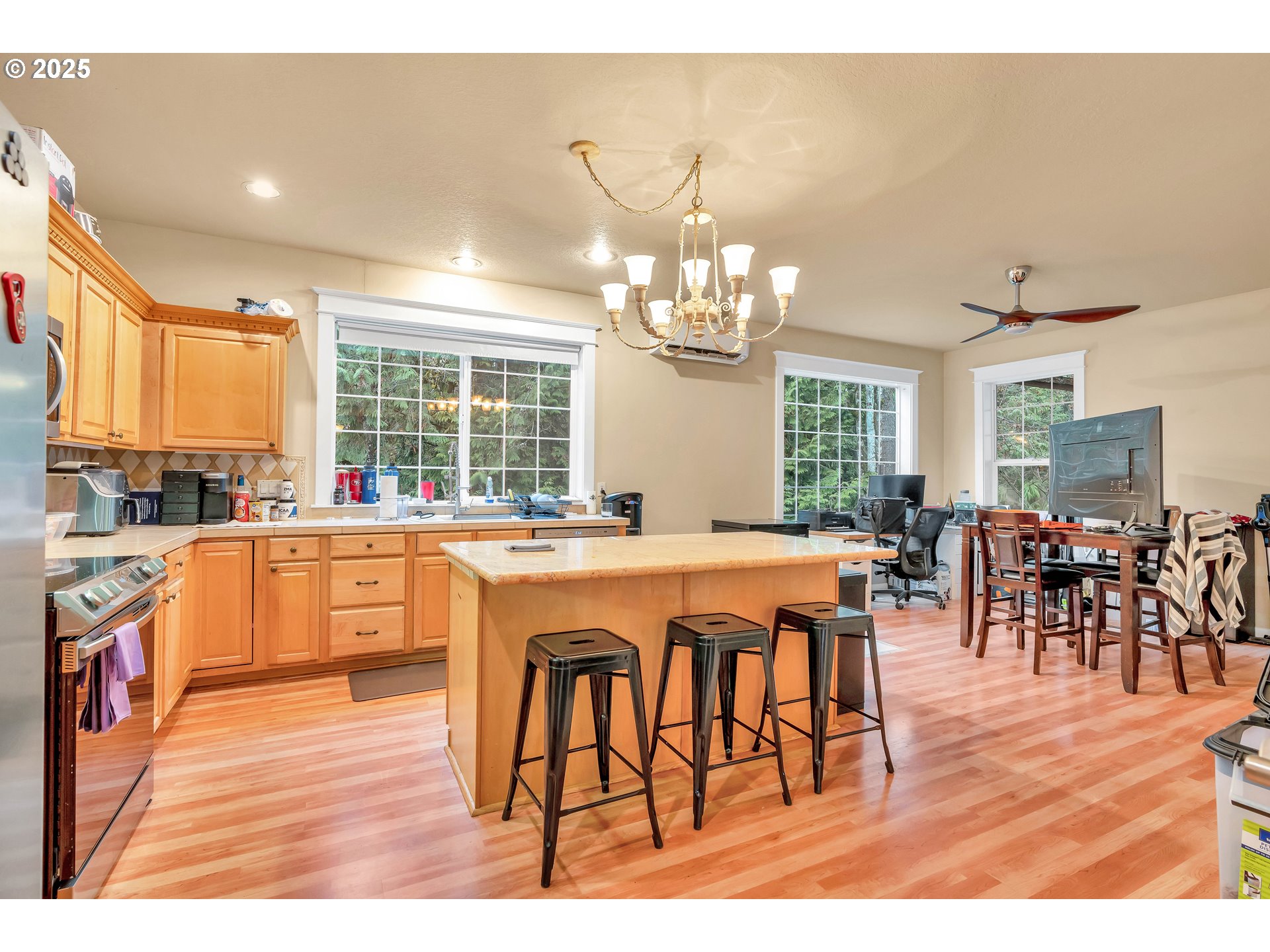 13755 Southwest Sandridge Drive Portland, OR 97223 - Photo 23 of 36 a large kitchen with lots of counter top space and stainless steel appliances
