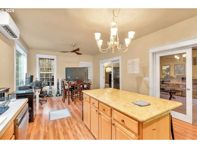 a open kitchen with a table and chairs