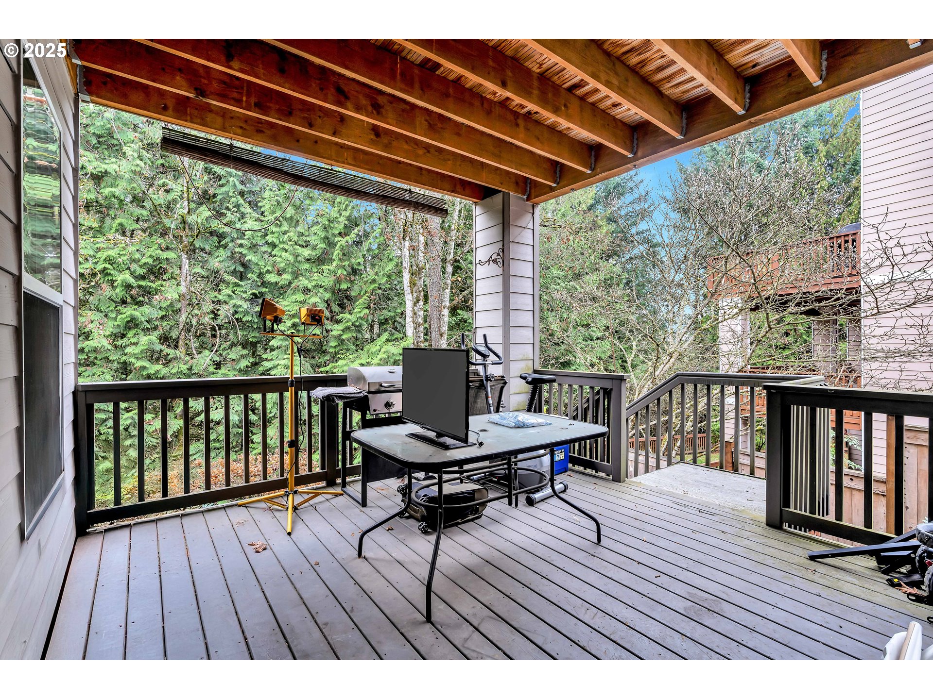 13755 Southwest Sandridge Drive Portland, OR 97223 - Photo 30 of 36 a view of balcony with wooden floor and outdoor seating
