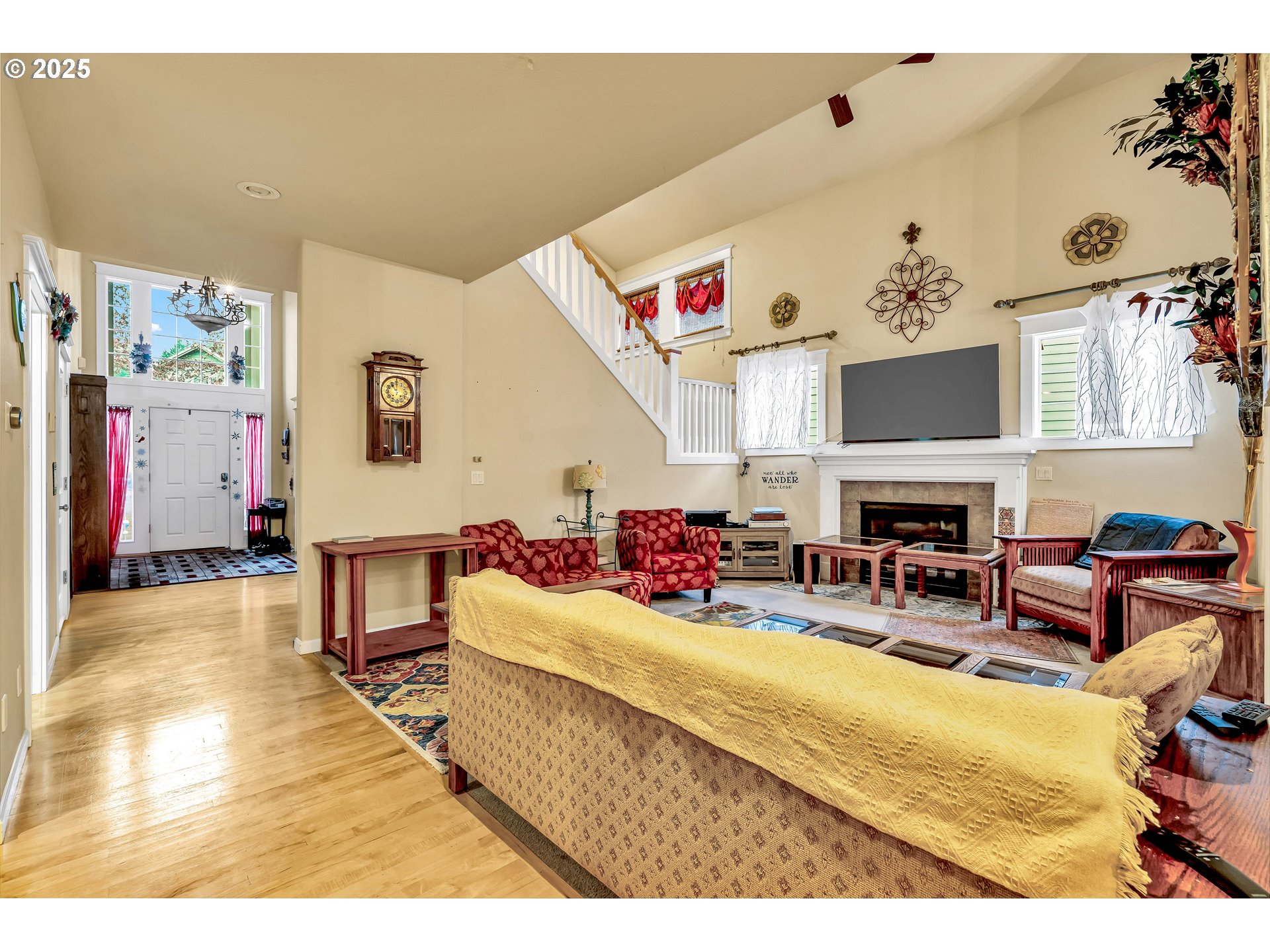 13755 Southwest Sandridge Drive Portland, OR 97223 - Photo 3 of 36 a living room with furniture and a fireplace