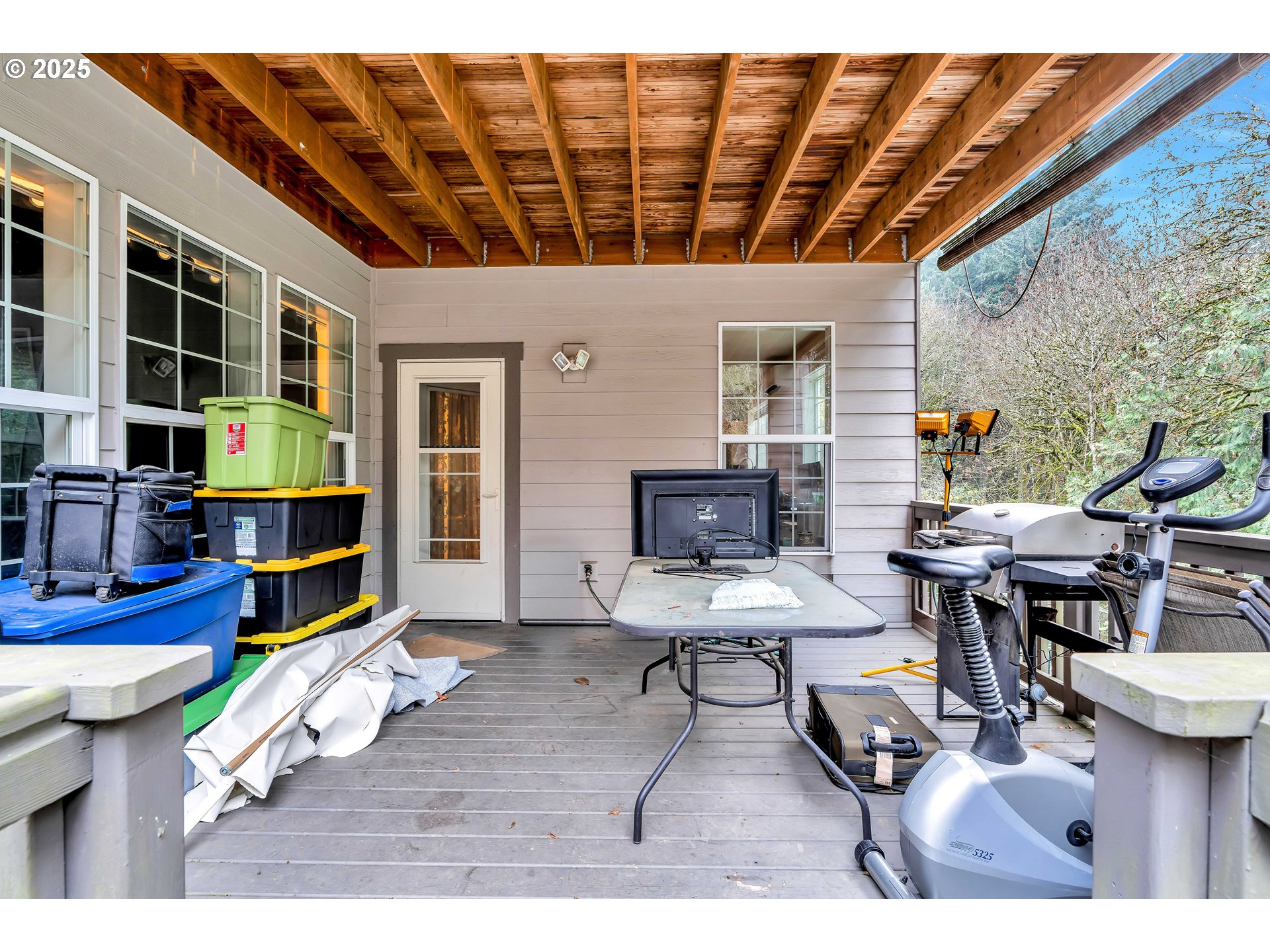 13755 Southwest Sandridge Drive Portland, OR 97223 - Photo 31 of 36 a living room with furniture a flat screen tv and a table
