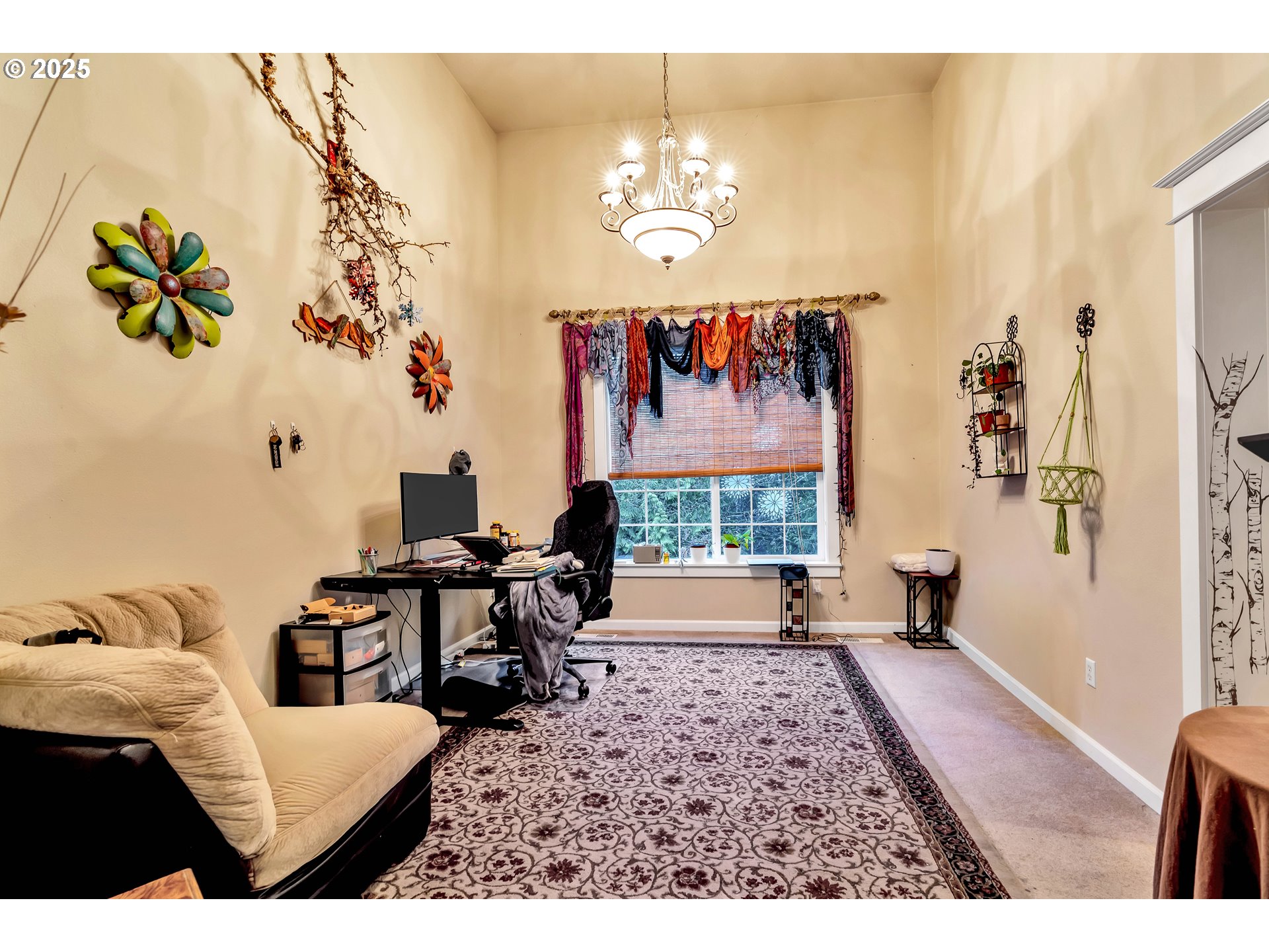13755 Southwest Sandridge Drive Portland, OR 97223 - Photo 7 of 36 a living room with furniture and a chandelier