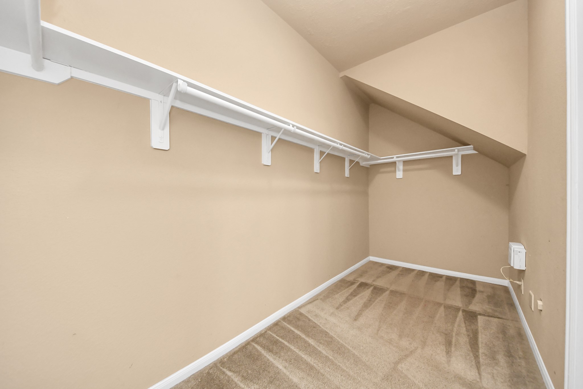 1 Desert Spring Lane Manvel, TX 77578 - Photo 28 of 45 a view of a room with racks on the wall