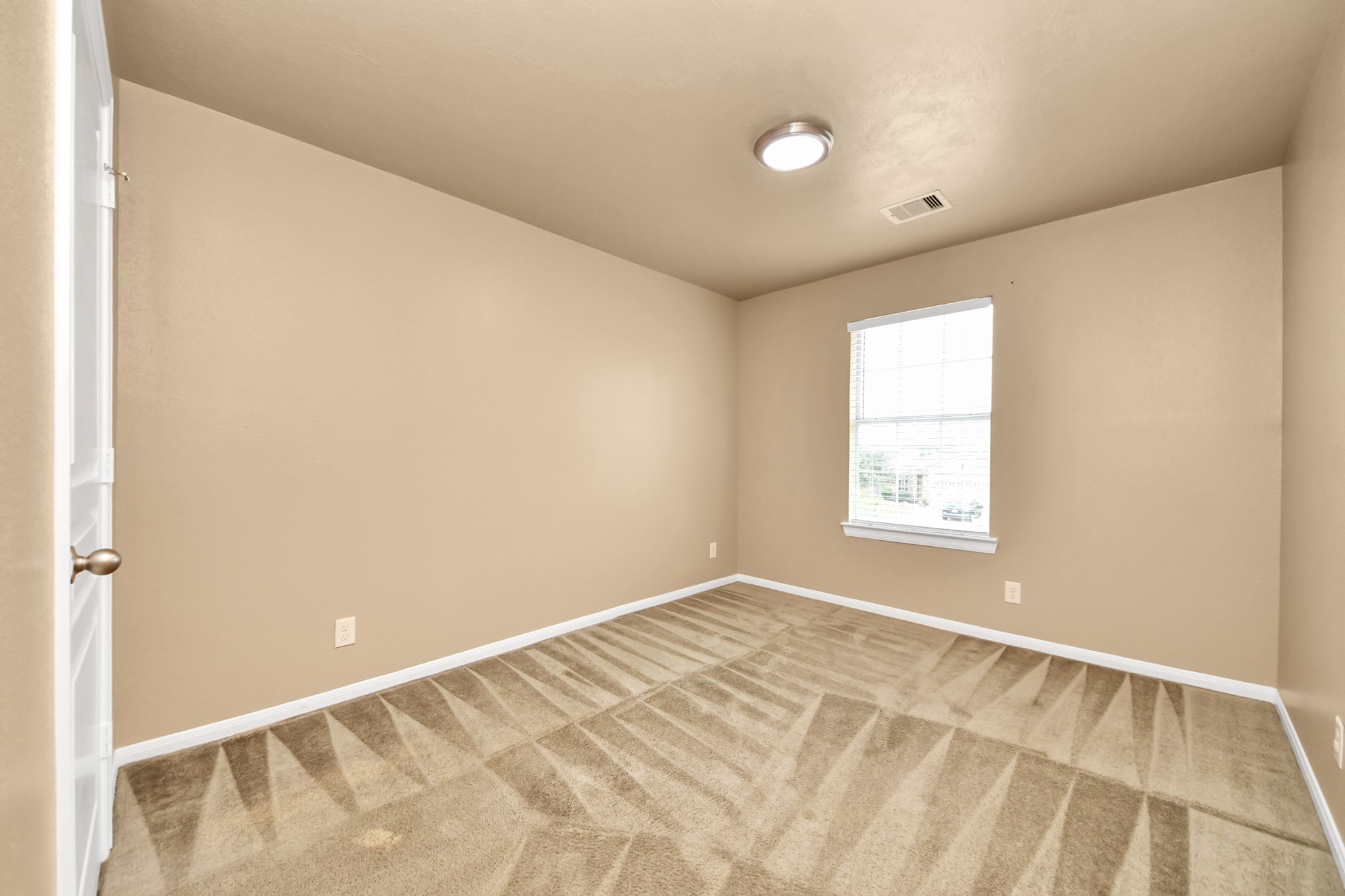1 Desert Spring Lane Manvel, TX 77578 - Photo 35 of 45 a view of an empty room with a window