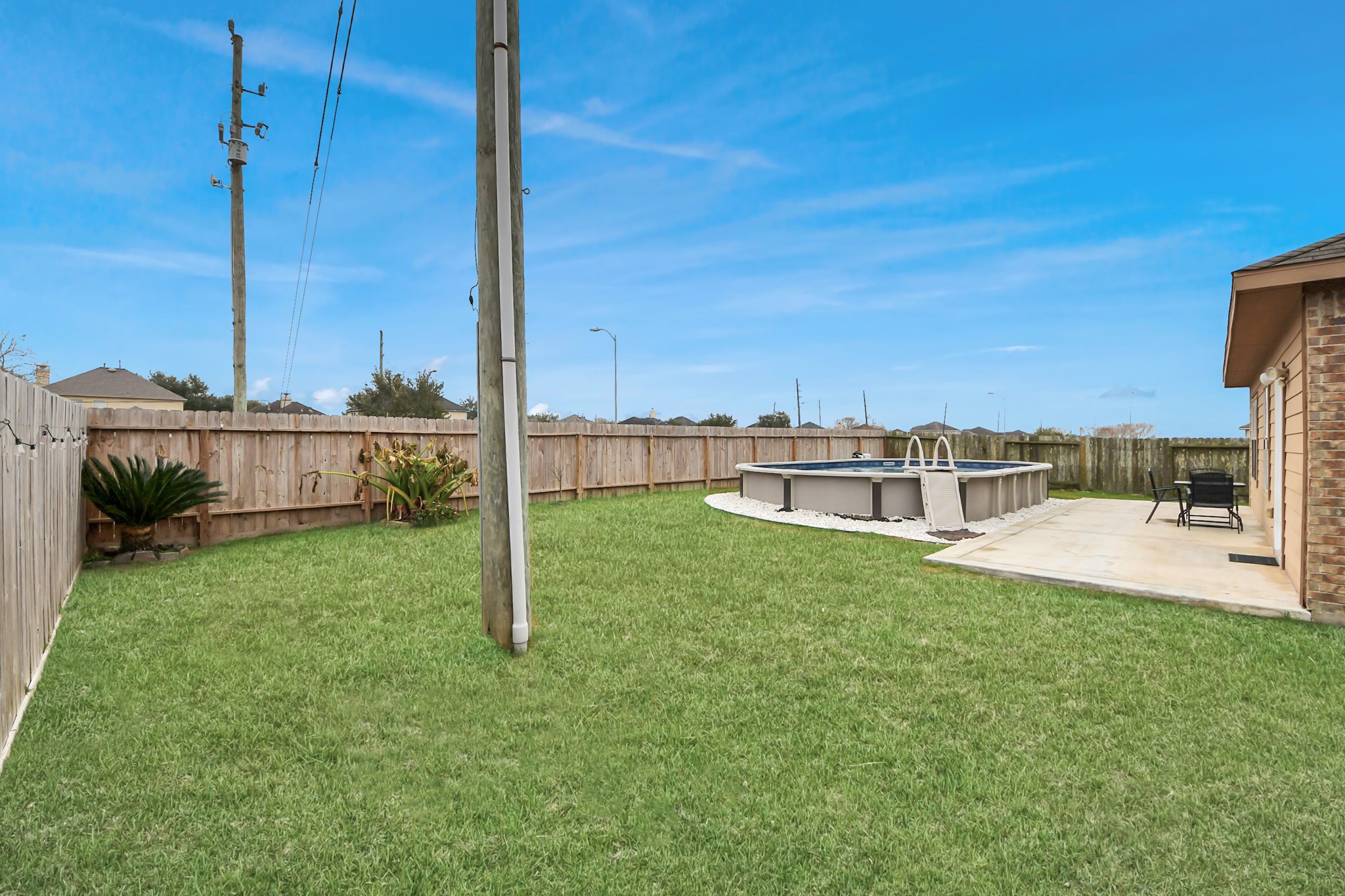 1 Desert Spring Lane Manvel, TX 77578 - Photo 40 of 45 a view of a patio with chairs and a yard
