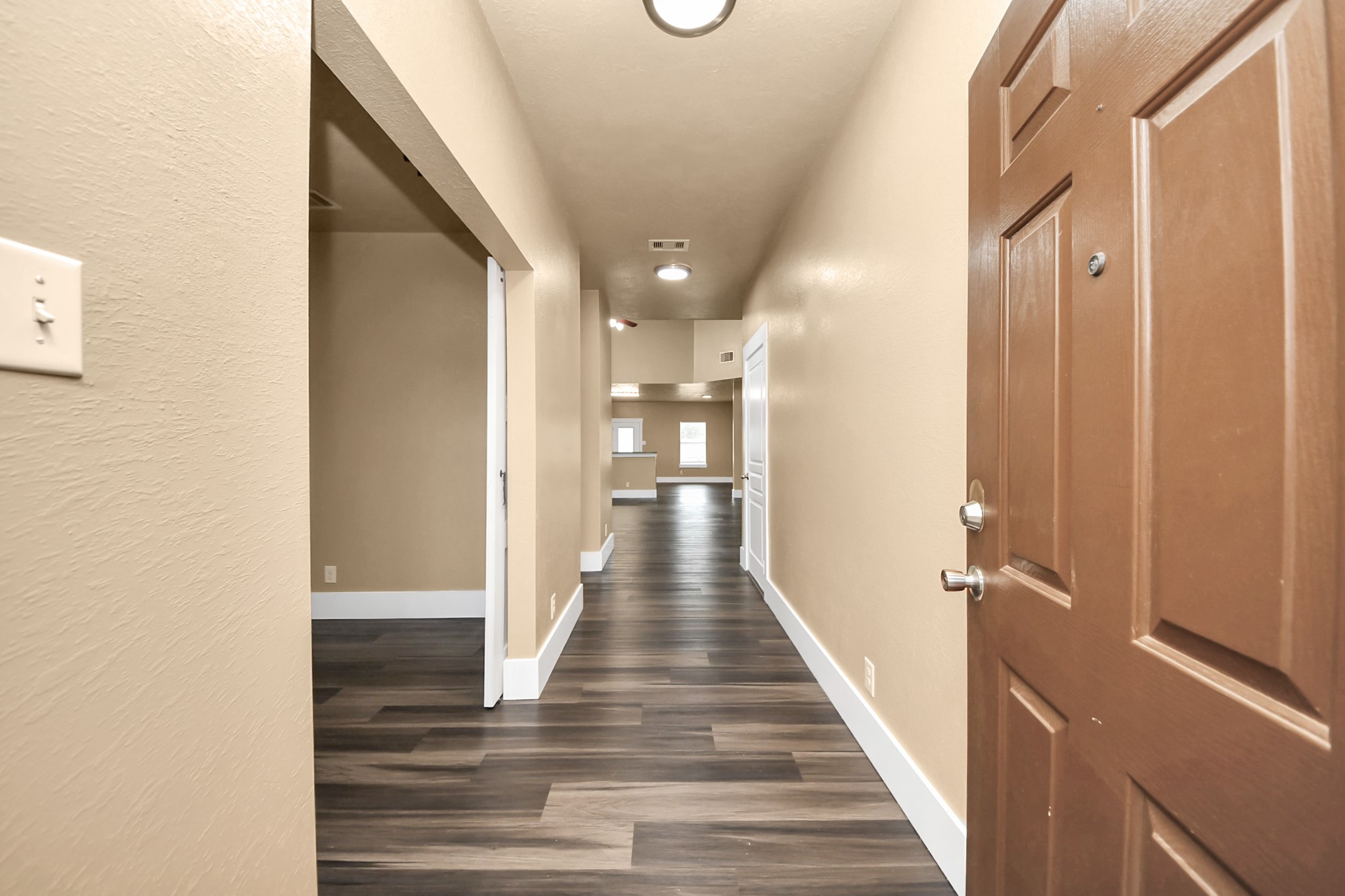 1 Desert Spring Lane Manvel, TX 77578 - Photo 4 of 45 a view of a hallway with wooden floor and staircase
