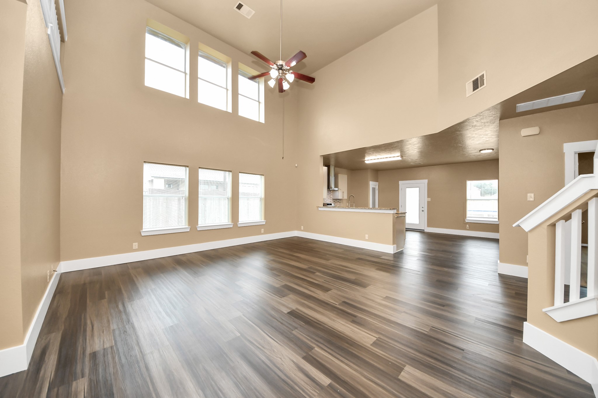 1 Desert Spring Lane Manvel, TX 77578 - Photo 6 of 45 a view of an empty room with wooden floor and a window