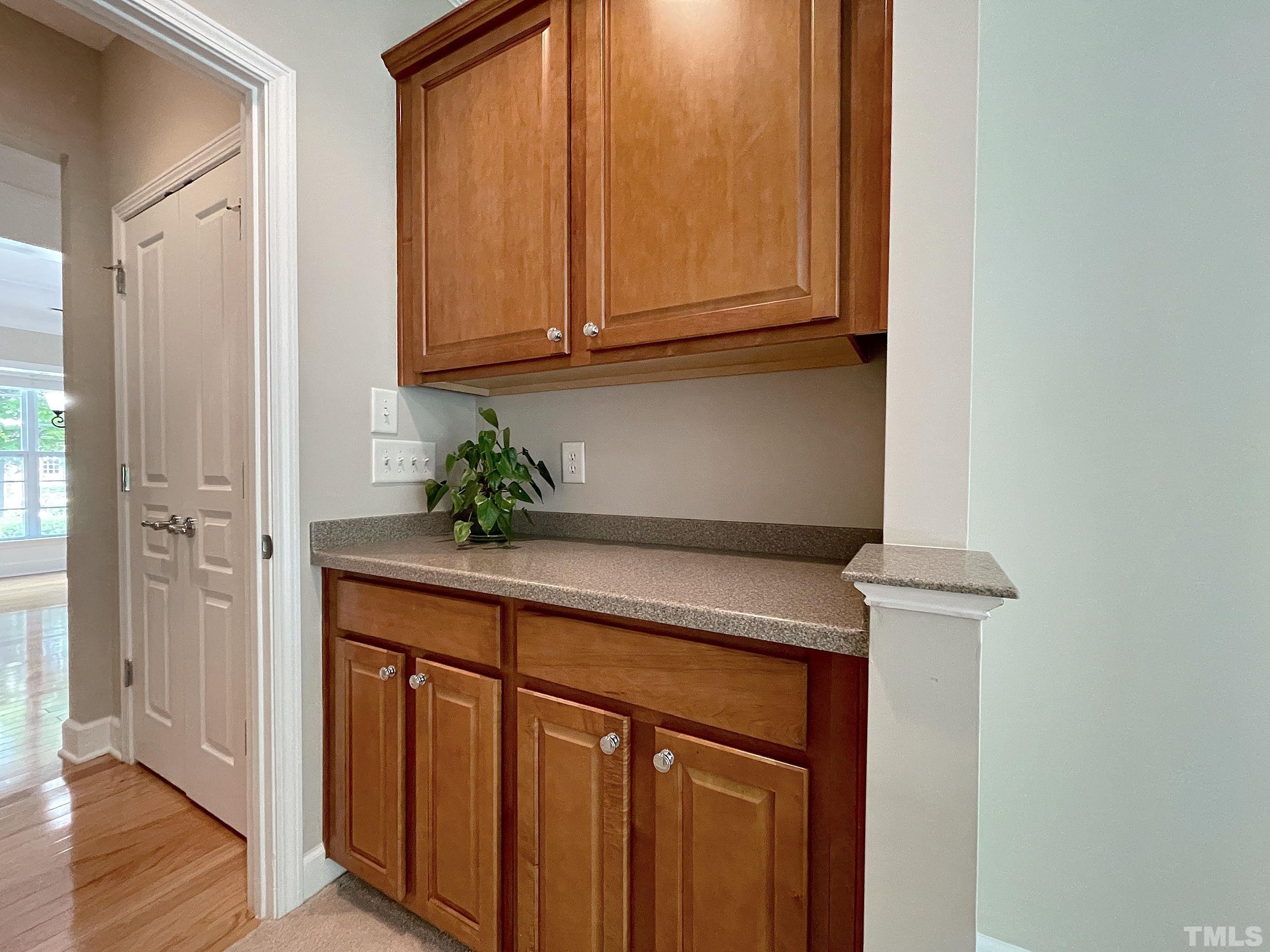 207 Beckingham Loop Cary, NC 27519 - Photo 17 of 40 a view of cabinets and wooden floor