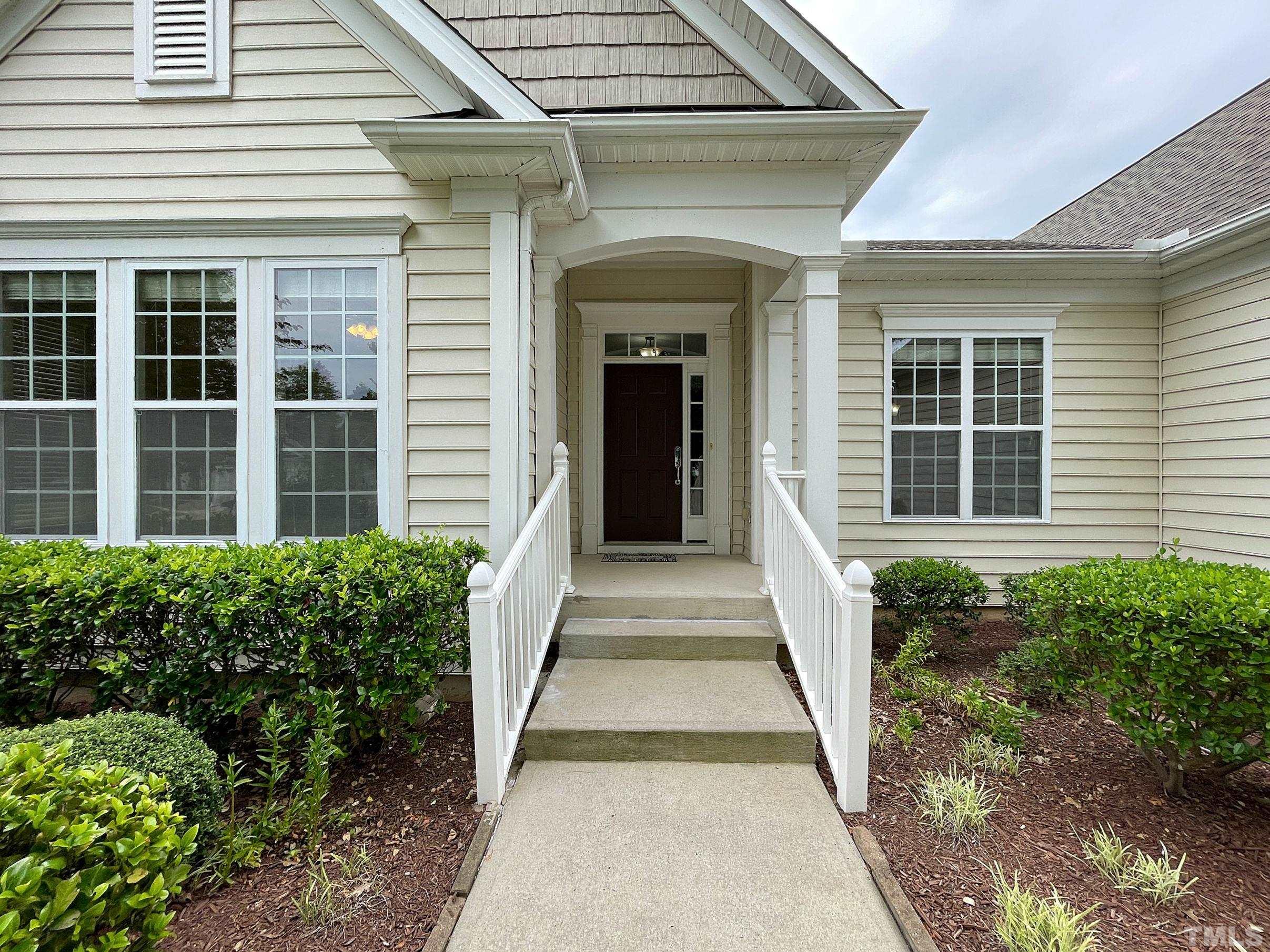 207 Beckingham Loop Cary, NC 27519 - Photo 2 of 40 a front view of a house with a yard