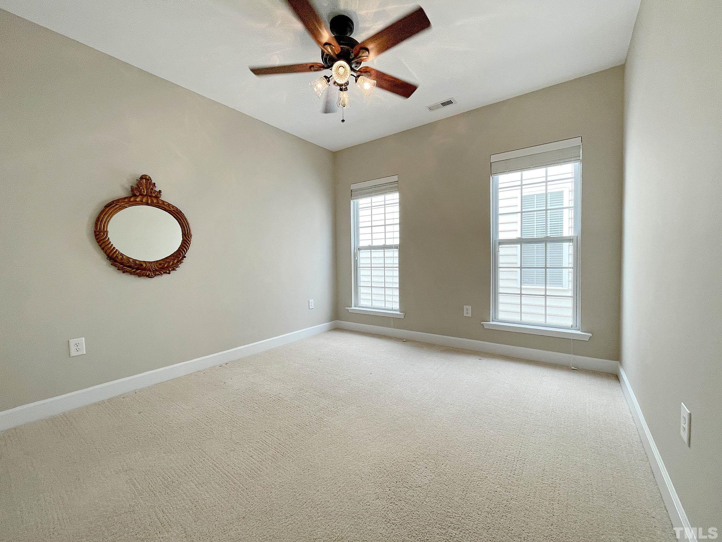 207 Beckingham Loop Cary, NC 27519 - Photo 21 of 40 a view of an empty room with a window