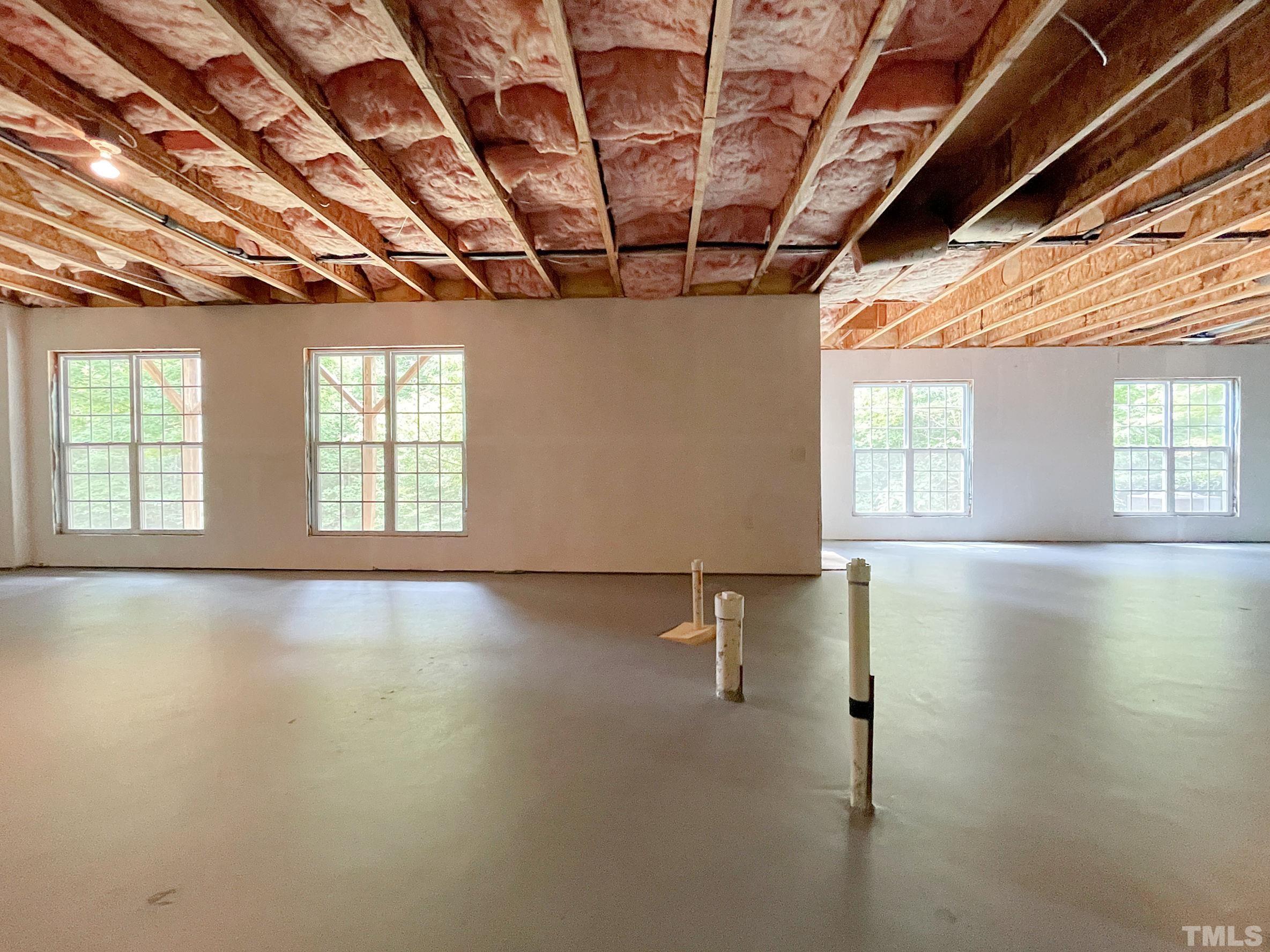 207 Beckingham Loop Cary, NC 27519 - Photo 23 of 40 an empty room with a empty space and windows