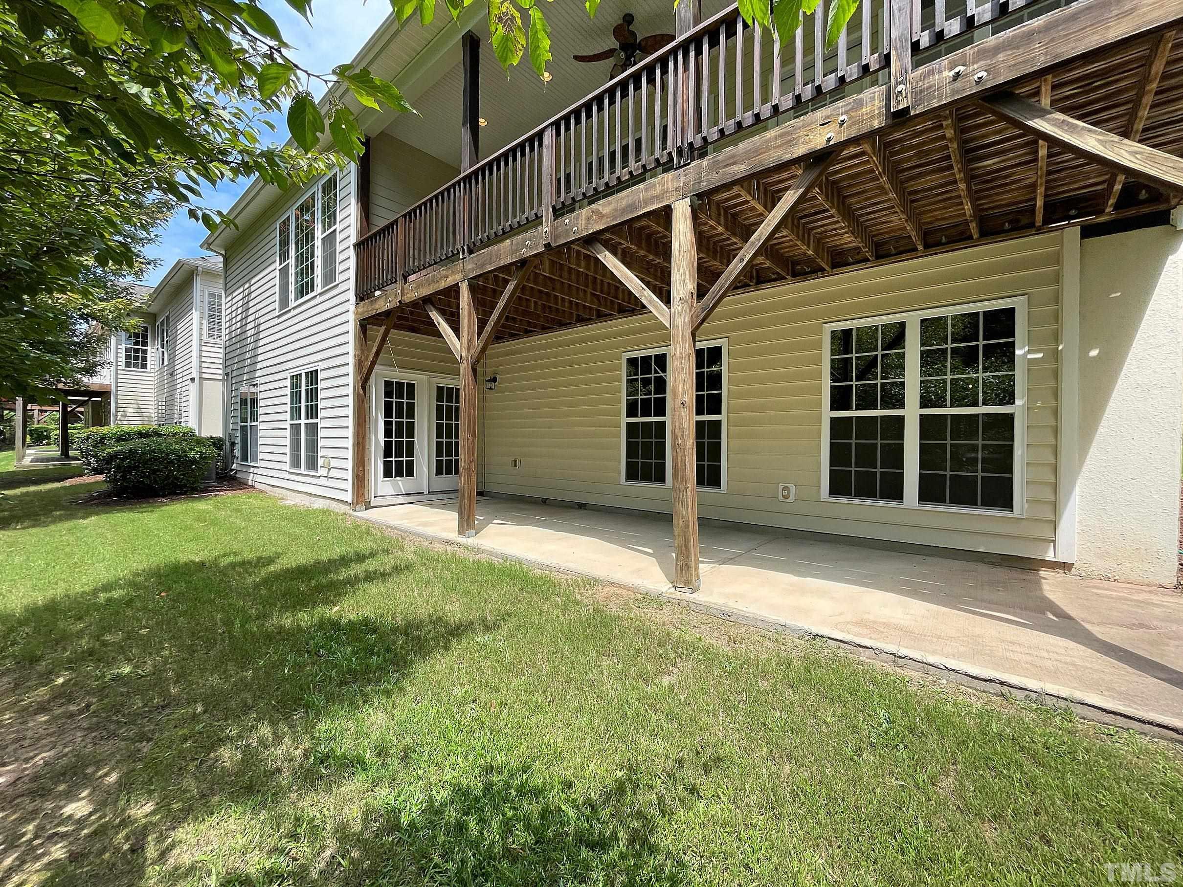 207 Beckingham Loop Cary, NC 27519 - Photo 29 of 40 a view of a house with a yard