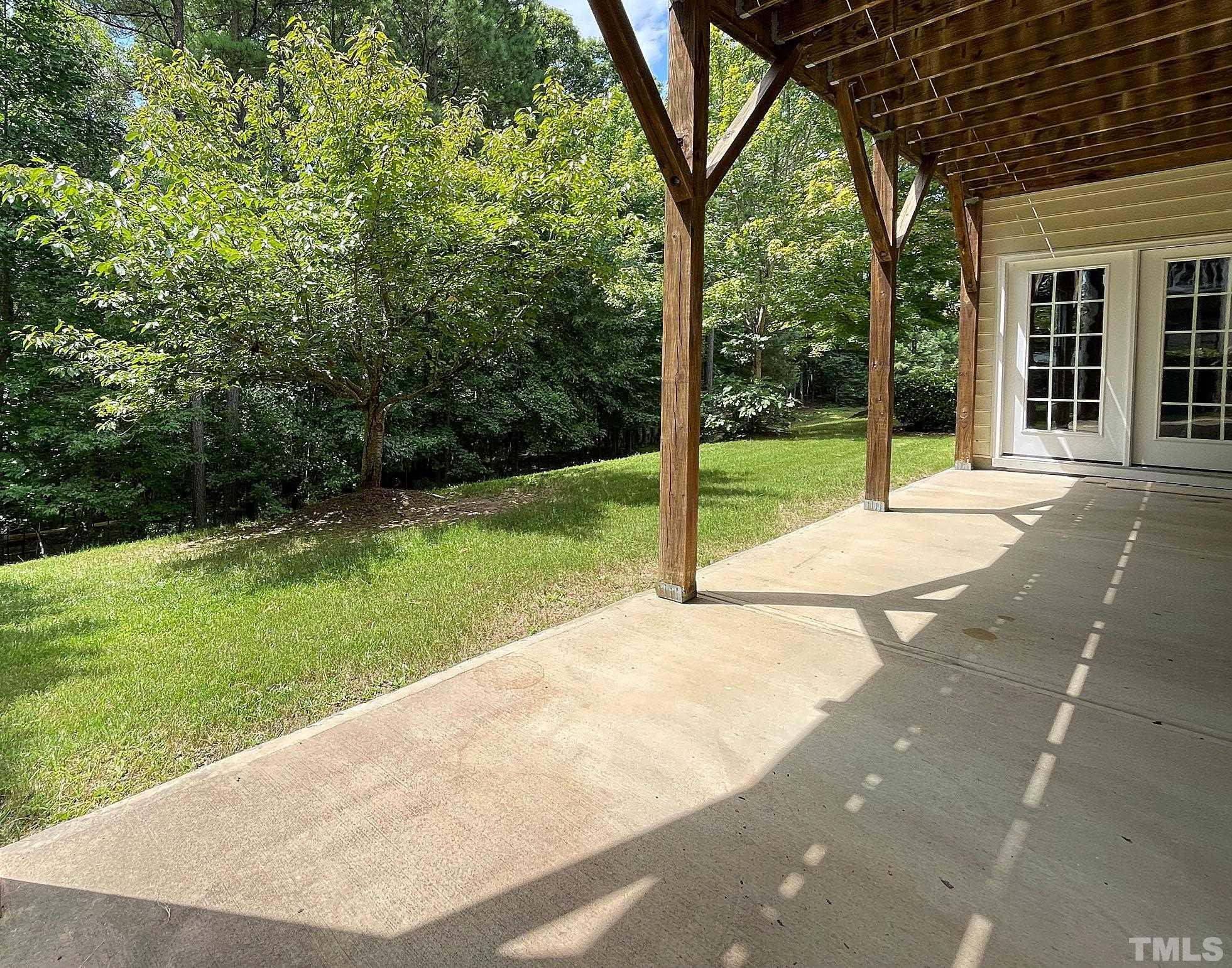 207 Beckingham Loop Cary, NC 27519 - Photo 30 of 40 a view of a backyard with garden