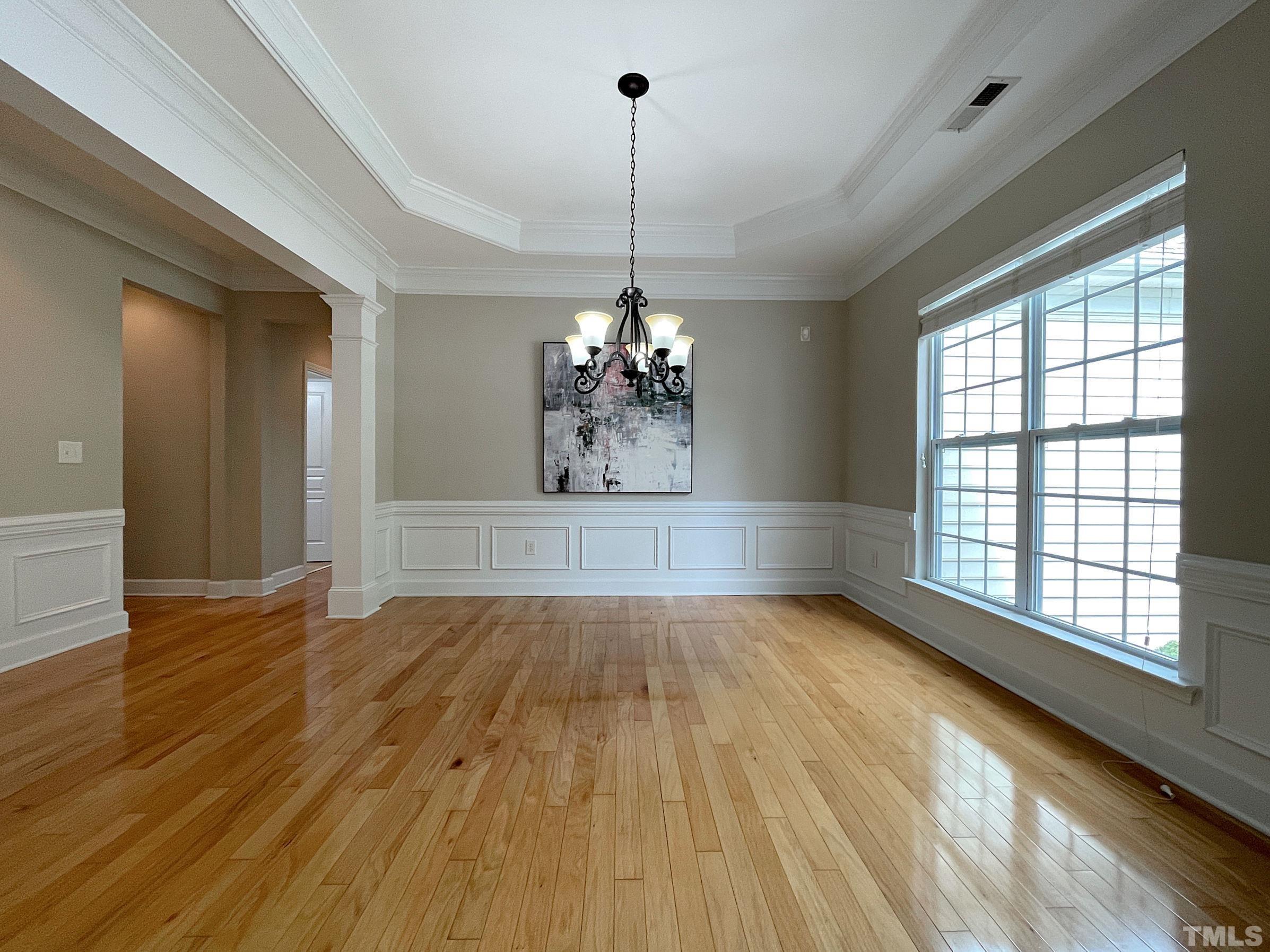 207 Beckingham Loop Cary, NC 27519 - Photo 5 of 40 a view of a room with wooden floor chandelier and windows