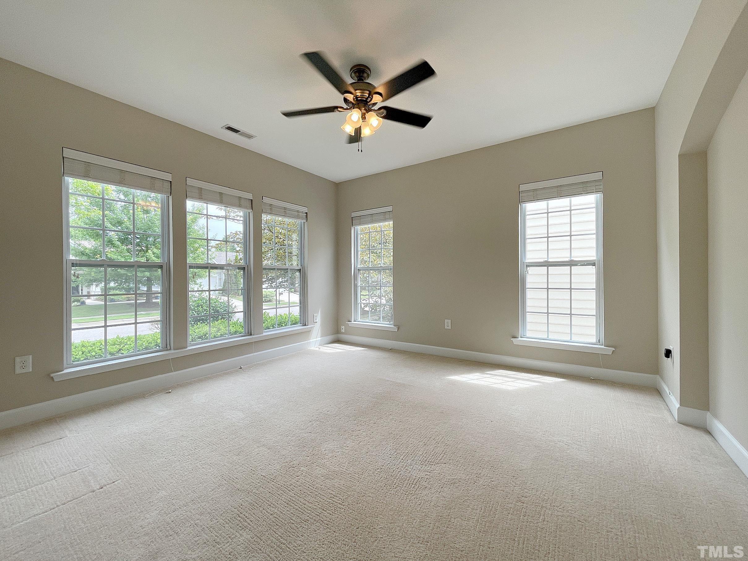 207 Beckingham Loop Cary, NC 27519 - Photo 6 of 40 a view of an empty room with a window