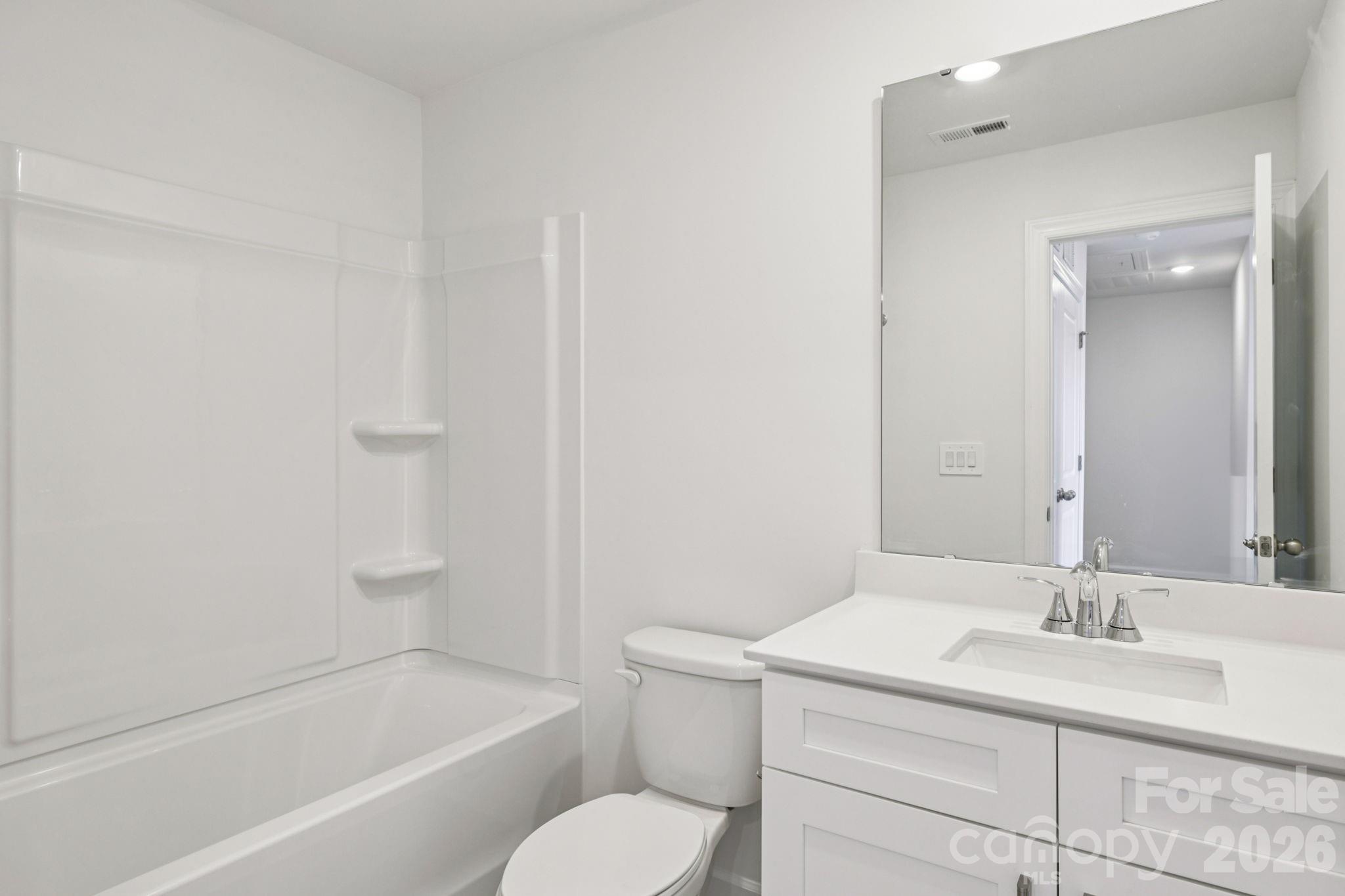 347 Golden Maple Court Fort Mill, SC 29708 - Photo 16 of 21 a bathroom with a granite countertop sink toilet and shower