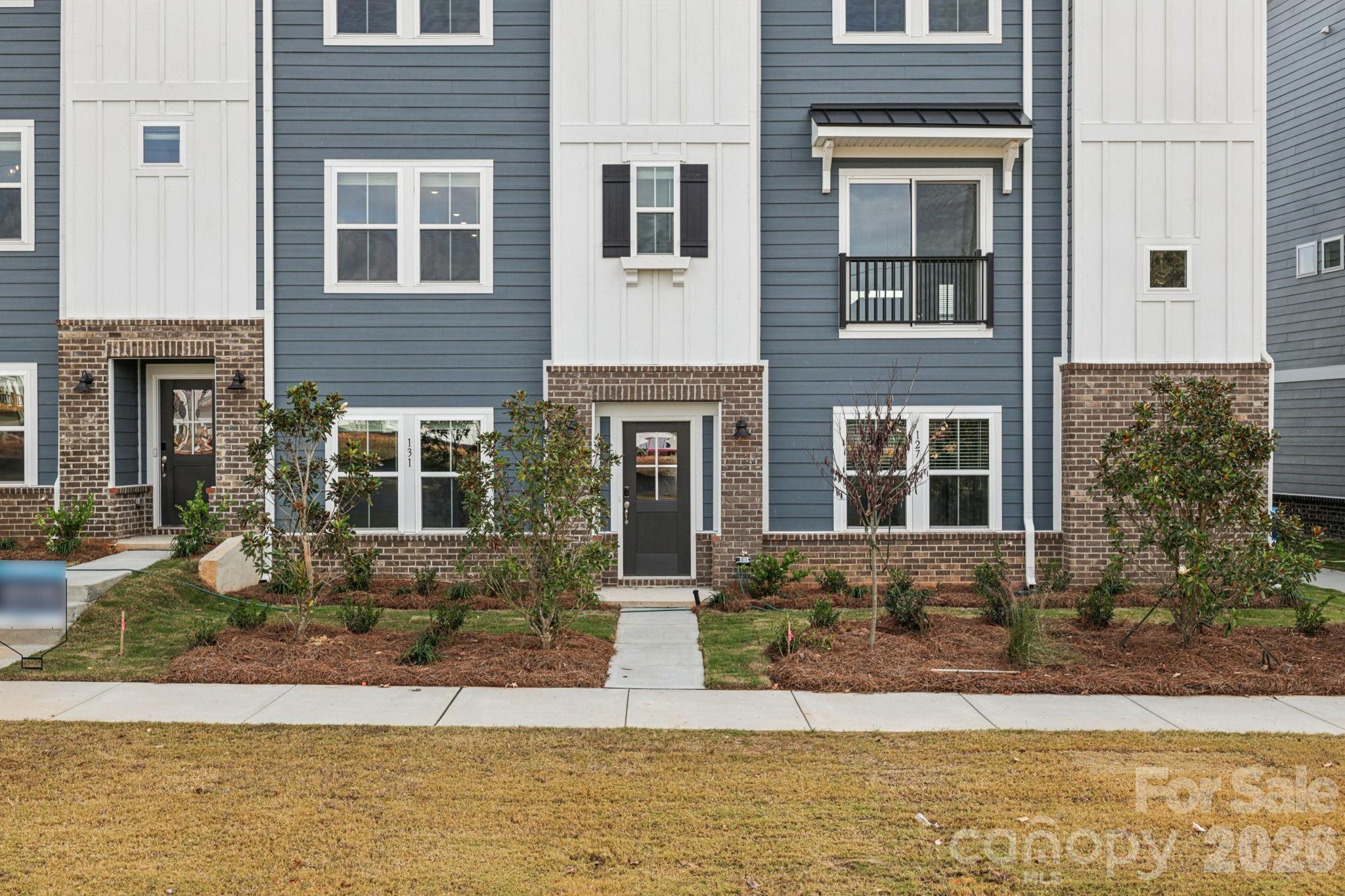 347 Golden Maple Court Fort Mill, SC 29708 - Photo 2 of 21 a front view of a house with lots of green space
