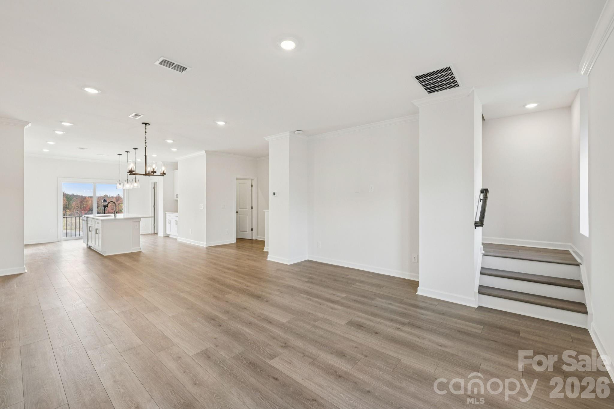 347 Golden Maple Court Fort Mill, SC 29708 - Photo 5 of 21 a view of a kitchen with wooden floor and a kitchen